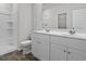 Bright bathroom features dual sinks, a framed mirror, and a stand-up shower at 1000 Sentinel Ct., Little River, SC 29566