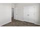 Bedroom showcasing double doors to a closet and luxury vinyl flooring at 1000 Sentinel Ct., Little River, SC 29566