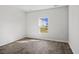 A bedroom with luxury vinyl flooring and a bright window showcasing an exterior view at 1000 Sentinel Ct., Little River, SC 29566