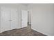 This bedroom includes two closet doors and sleek wood-look vinyl flooring at 1000 Sentinel Ct., Little River, SC 29566