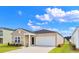 Charming one-story home featuring a one car garage, neutral siding, and a well-manicured lawn at 1000 Sentinel Ct., Little River, SC 29566