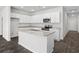Modern kitchen with granite countertops, stainless steel appliances and an island with sink at 1000 Sentinel Ct., Little River, SC 29566
