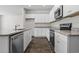 Spacious kitchen features stainless steel appliances, granite countertops, and ample cabinet space at 1000 Sentinel Ct., Little River, SC 29566