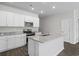 Modern kitchen boasts stainless steel appliances, granite countertops, and central island at 1000 Sentinel Ct., Little River, SC 29566