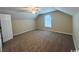 Large bedroom with neutral-toned walls, carpeted floors, a ceiling fan, and a window at 1000 Weldon Ln., Conway, SC 29526