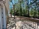Wooden deck surrounded by lush trees, offering a serene outdoor space at 1000 Weldon Ln., Conway, SC 29526