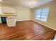 Cozy dining area featuring hardwood flooring, a chandelier, and a large window offering natural light at 1000 Weldon Ln., Conway, SC 29526