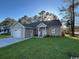 Charming one-story home with a garage, well-manicured lawn, and inviting entrance at 1000 Weldon Ln., Conway, SC 29526