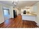 Open concept kitchen featuring stainless steel appliances, hardwood flooring, and a breakfast bar at 1000 Weldon Ln., Conway, SC 29526