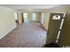 Bright living room showcasing carpet flooring, neutral walls, and large windows offering natural light at 1000 Weldon Ln., Conway, SC 29526