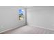 Bright bedroom features neutral carpet, light gray walls and a window with a view of the outdoors at 1008 Sentinel Ct., Little River, SC 29566