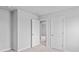 Neutral bedroom with light gray walls, neutral carpet, and open and closed white doors leading to other rooms at 1008 Sentinel Ct., Little River, SC 29566