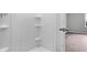 Clean, bright shower features built-in shelves, perfect for organization at 1008 Sentinel Ct., Little River, SC 29566