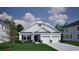Charming single-Gathering home featuring a two car garage and a well-maintained front yard at 1075 Laconic Dr., Myrtle Beach, SC 29588
