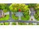 Aerial view of the property showcasing its lush landscaping, mature trees, and neighborhood surroundings at 12 Jerry Ct., Pawleys Island, SC 29585