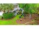 Aerial view of the backyard featuring a fire pit, Adirondack chairs and an exterior staircase at 12 Jerry Ct., Pawleys Island, SC 29585
