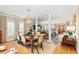 Open-concept dining room with stylish lighting, wooden table, and seamless flow to the living areas at 12 Jerry Ct., Pawleys Island, SC 29585