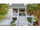 Charming front porch with decorative door and stylish railings, creating a welcoming entrance at 12 Jerry Ct., Pawleys Island, SC 29585