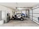 Spacious garage featuring golf cart and car parking, storage space, and white walls at 12 Jerry Ct., Pawleys Island, SC 29585