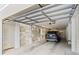 Large, open garage featuring white siding and a parked car at 12 Jerry Ct., Pawleys Island, SC 29585