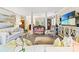 Bright and airy living room featuring stylish furnishings, elegant decor, and a seamless flow to the dining area at 12 Jerry Ct., Pawleys Island, SC 29585