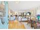 Open-concept living space with hardwood floors and natural light, seamlessly connecting the living and dining areas at 12 Jerry Ct., Pawleys Island, SC 29585