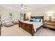 Tranquil main bedroom with crown molding, ample natural light, and sitting area at 12 Jerry Ct., Pawleys Island, SC 29585