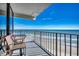 Balcony with seating offers ocean views, perfect for relaxing and enjoying the seaside scenery at 1210 N Waccamaw Dr. # 602, Murrells Inlet, SC 29576