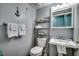 Cozy bathroom with toilet, sink, and decorative anchor hangings at 1210 N Waccamaw Dr. # 602, Murrells Inlet, SC 29576