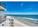 Beautiful beach view from the balcony of condo with a view of the ocean and sandy beach at 1210 N Waccamaw Dr. # 602, Murrells Inlet, SC 29576