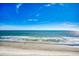 Beautiful beach view with blue sky with fluffy clouds and sunlight reflecting off the water at 1210 N Waccamaw Dr. # 602, Murrells Inlet, SC 29576