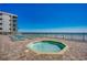 Relaxing outdoor hot tub with lounge chairs and ocean views, perfect for unwinding at 1210 N Waccamaw Dr. # 602, Murrells Inlet, SC 29576
