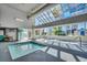 Bright indoor pool area with skylights and ample natural light, creating a serene retreat at 1210 N Waccamaw Dr. # 602, Murrells Inlet, SC 29576