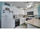 Bright kitchen featuring white cabinets, modern appliances, and a breakfast bar at 1210 N Waccamaw Dr. # 602, Murrells Inlet, SC 29576