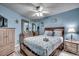 Comfortable main bedroom features a queen-size bed, dresser, and beach-themed decor at 1210 N Waccamaw Dr. # 602, Murrells Inlet, SC 29576