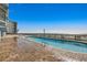 Relaxing community pool with ocean view and a brick deck for lounging at 1210 N Waccamaw Dr. # 602, Murrells Inlet, SC 29576