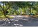 Entrance of Tidewater Golf Club and Plantation surrounded by lush landscaping and trees at 1221 Tidewater Dr. # 2112, North Myrtle Beach, SC 29582