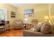 Comfortable seating area with stylish decor and wood floors, perfect for relaxing and entertaining at 1221 Tidewater Dr. # 2112, North Myrtle Beach, SC 29582