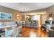 Open-concept living area with hardwood floors, modern lighting, and a breakfast bar to the kitchen at 1221 Tidewater Dr. # 2112, North Myrtle Beach, SC 29582