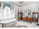 Luxurious bathroom with marble floors, soaking tub, crystal chandelier, and custom vanities provides an elegant and relaxing space at 123 Pioneer Loop, Georgetown, SC 29440
