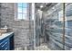 Modern bathroom featuring a glass-enclosed shower with unique tile work and stylish fixtures exemplifies contemporary design at 123 Pioneer Loop, Georgetown, SC 29440