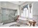 Luxurious bathroom with a soaking tub, tiled shower, and stylish fixtures at 123 Pioneer Loop, Georgetown, SC 29440