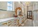 Lavish bathroom with dual sinks, elegant gold accents, and a marble countertop at 123 Pioneer Loop, Georgetown, SC 29440