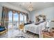 Stunning bedroom with ocean view balcony access and ornate decor at 123 Pioneer Loop, Georgetown, SC 29440