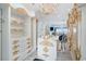 Spacious walk-in closet with custom shelving, drawers, and ornate gold accents at 123 Pioneer Loop, Georgetown, SC 29440