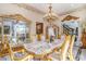 A grand dining room with ornate gold accents, an elegant chandelier, and a long table for formal gatherings at 123 Pioneer Loop, Georgetown, SC 29440