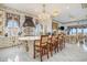 A spacious kitchen boasts a marble island with seating for five and luxury finishes at 123 Pioneer Loop, Georgetown, SC 29440