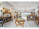A luxurious living room boasts a marble floor, high ceilings with gold trim, and an elegant sitting area with ocean views at 123 Pioneer Loop, Georgetown, SC 29440