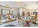 Grand living area showcasing elaborate gold detailing, chandeliers, and marble floors at 123 Pioneer Loop, Georgetown, SC 29440