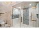 Modern shower featuring glass doors, tile design, and brushed gold hardware at 123 Pioneer Loop, Georgetown, SC 29440